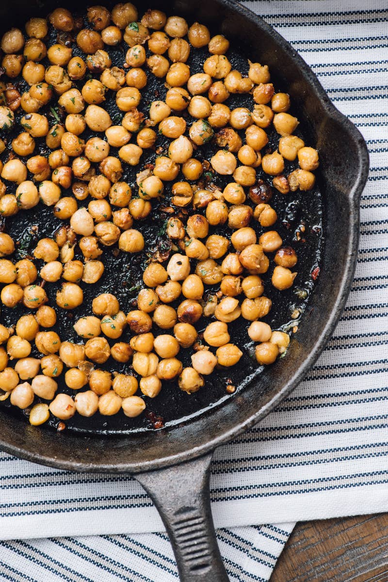 Ingredients: 1 can (15.5 oz) of chickpeas; 2 tablespoons olive oil; ½ teaspoon kosher salt; 2 teaspoons minced jalapeño; 1 tablespoon chopped cilantro. To make: Drain, rinse, and pat the chickpeas dry. Heat olive oil in a cast-iron pan. Add the chickpeas, salt, and minced jalapeño. Cook, stirring frequently, until chickpeas are brown and crispy, about 10 minutes. Remove from heat and toss with cilantro.