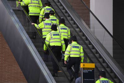 Police officers work near The Shard and London Bridge in London on 4 June 2017.