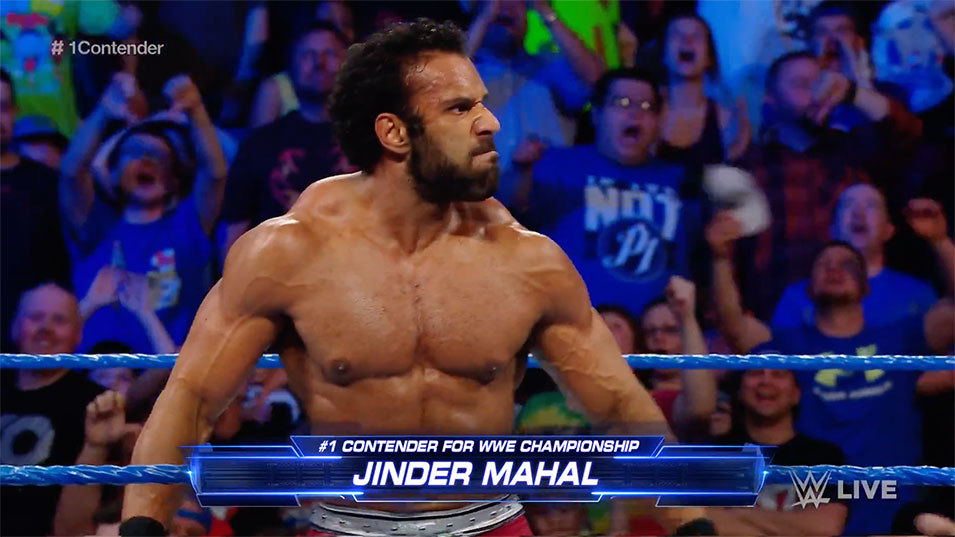 As the old adage goes, your reputation precedes you. Someone hears a name and thinks directly of the stigma attached to it. The very first thing that has been done with Jinder Mahal has been to remove the stigma that his own name used to be attached to. Six months ago, Jinder Mahal was an afterthought of a superstar. He was that guy who used to be in 3MB. A jobber tagging with Rusev for some unknown reason. He was drifting more than Elias Samson. However, a potential emerging market in India meant an opportunity lay in waiting for someone, and who better than a wrestler with strong Indian heritage? A guy who could simultaneously portray a heel on one side of the planet and a face on the other? Whether this was on Jinder Mahal’s mind already or it was suggested to him, a change of attitude and physical appearance later, the rise of The Maharaja had begun. The addition of ‘The Maharaja’ to Jinder’s name was an excellent idea. For a start, I don’t expect someone who calls himself the Maharaja to be a cowardly champion. It’s too grand a title to a) undermine by having him run away from challengers or b) simply waste on a fleeting champion. This is him now. This is his new identity. In self-proclamation, ‘The Maharaja’ not only oozes arrogance and self-importance – it also has an air of grandiosity to it that other nicknames or catchphrases don’t. It doesn’t feel as contrived as ‘Wrestling God’. It’s not as outright attention seeking as ‘I’m Awesome’. It carries a certain air of indignation to it, as if fans should truly revere rather than rebuke. It demands respect. For a heel, that is absolutely perfect. For a face – in India at least – it stokes the fires of patriotism.