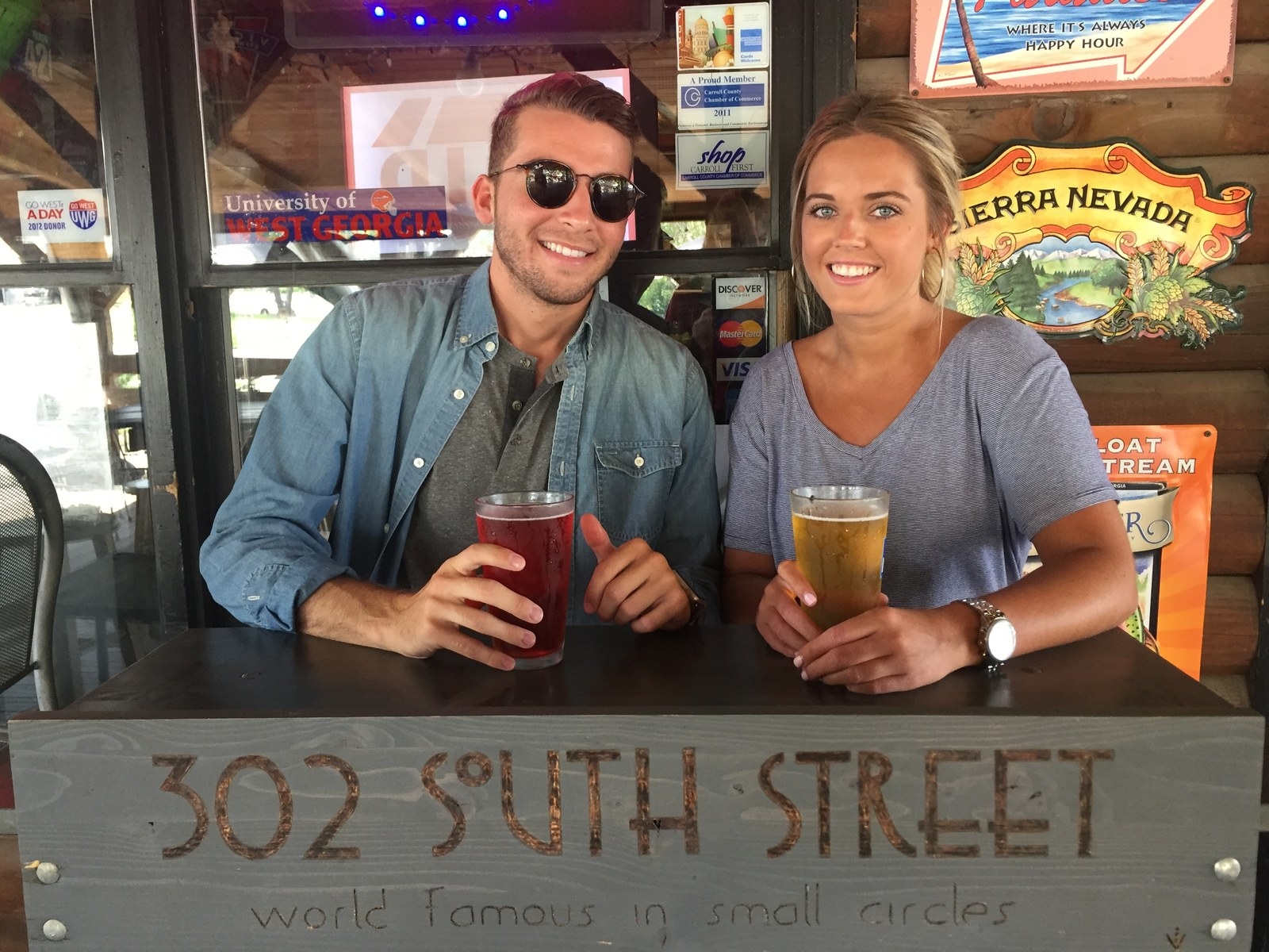 302 South Street has been a town favorite for 6 years now! I love hanging out on their front porch on a Friday Night, listening to live music and chowing down on one of their Famous Sandwiches like the Eiffel Tower, the Gold Fever Pork Grilled Cheese, or the Hotlanta wrap... all while washing it down with an ice cold beer! Our favorite beer to sip on (or chug) is a local beer from Printer's Ale Brewery! They use Hibiscus Lime as one of their ingredients, which makes it EXTREMELY TASTY! Tell our Favorite Bartender, Ryan, that we said he can be VERY generous with his pour! ;)