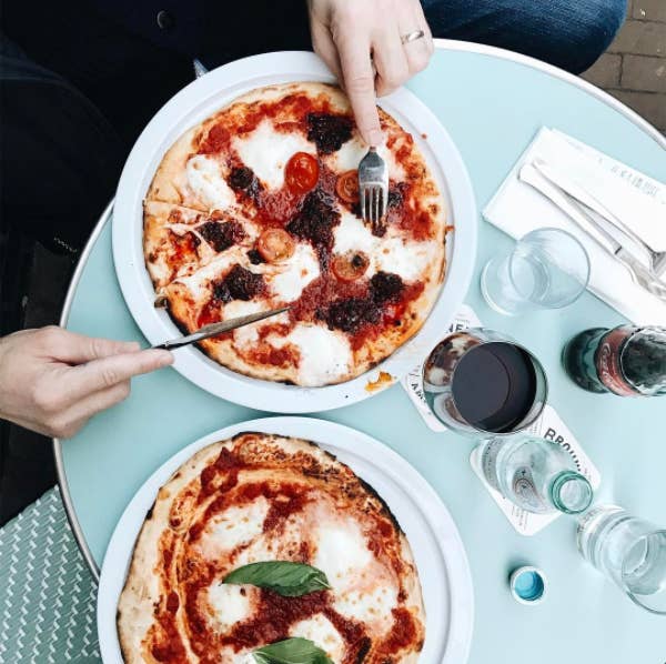 Getting your hands on the thin and crispy pies at La Perla comes with a serious wait, but oh my godoness, that pizza.