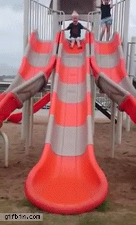 This kid isn't sure what all the fuss about slides is about: