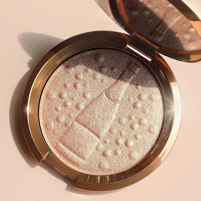Promising review: "First high-end highlighter and totally worth it. You can either put on just a bit to give a natural glow or build it up and it will be BLINDING. It's just so amazing. Stays on really well and just the right amount of shimmer. A little goes a long way." —Lanyi HuangGet it from Sephora for $38 (available in regular Champagne Pop packaging as well as seven additional shades).