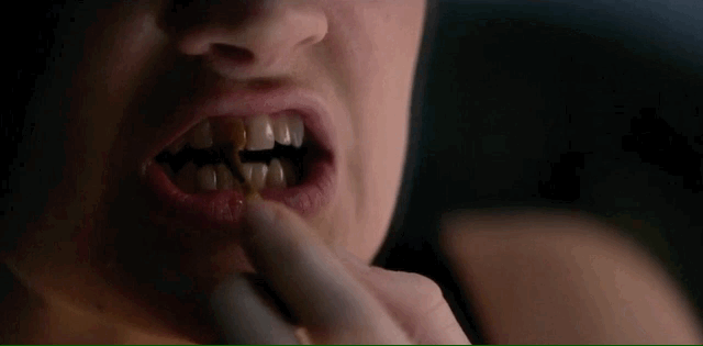 A lot of viewers thought that’s what she was painting on her teeth, but Grossman clarified that it’s a tooth decay special effect (similar to this) that you could find at a Halloween store. (Remember, it had to be something that the character could feasibly buy herself.)
