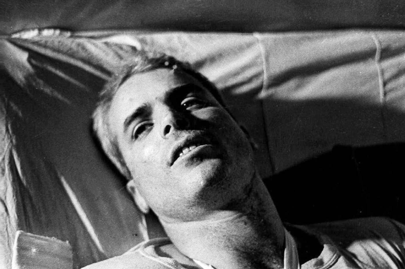 McCain lying on a bed in a Hanoi hospital as he was being given medical care for his injuries in 1967.