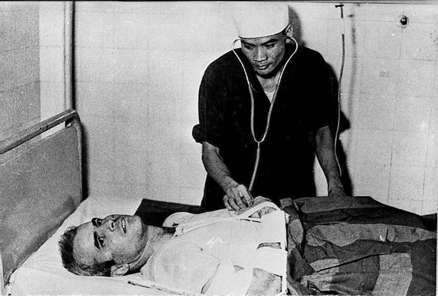 McCain is examined by a Vietnamese doctor in 1967.