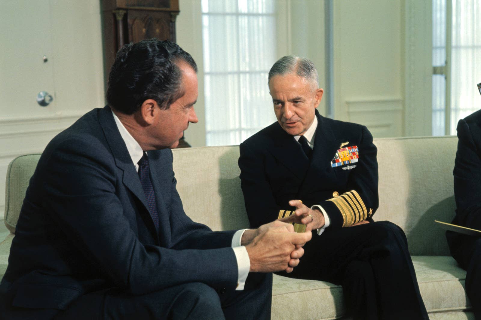 President Nixon speaks with Adm. John S. McCain, commander in chief of US forces in the Pacific, whose son is a prisoner of war in Vietnam.
