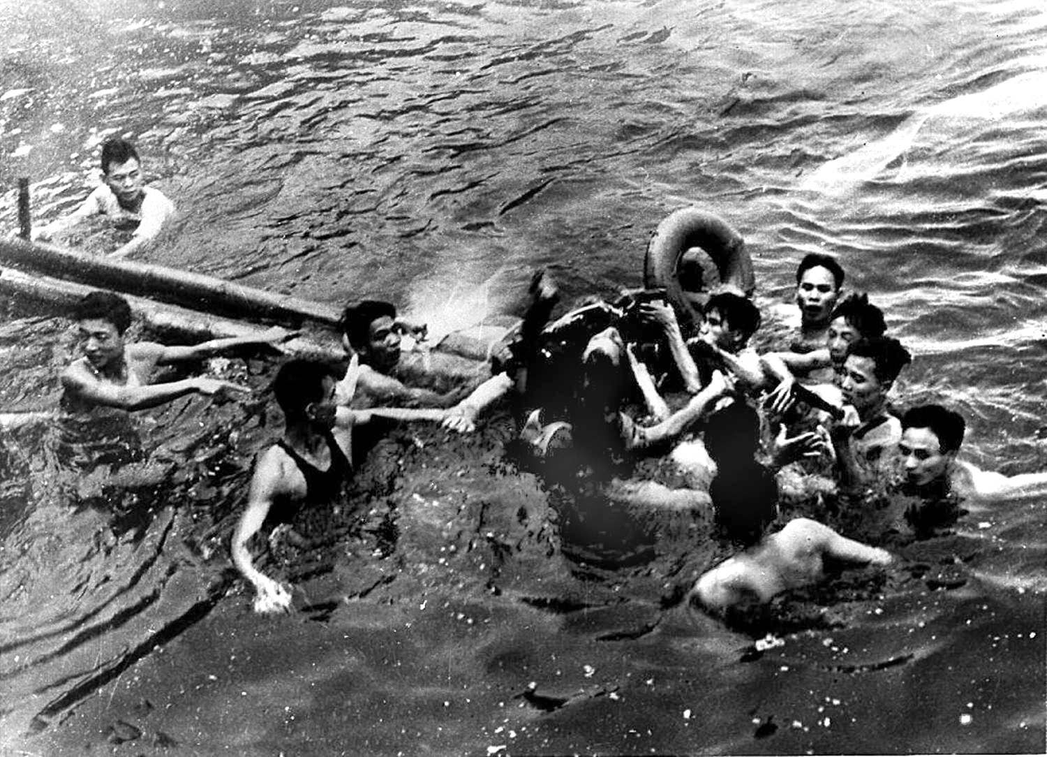 McCain (center) is rescued from Hanoi&#x27;s Truc Bach Lake by several Hanoi residents after his Navy warplane was downed by the North Vietnamese Army on Oct. 26, 1967.