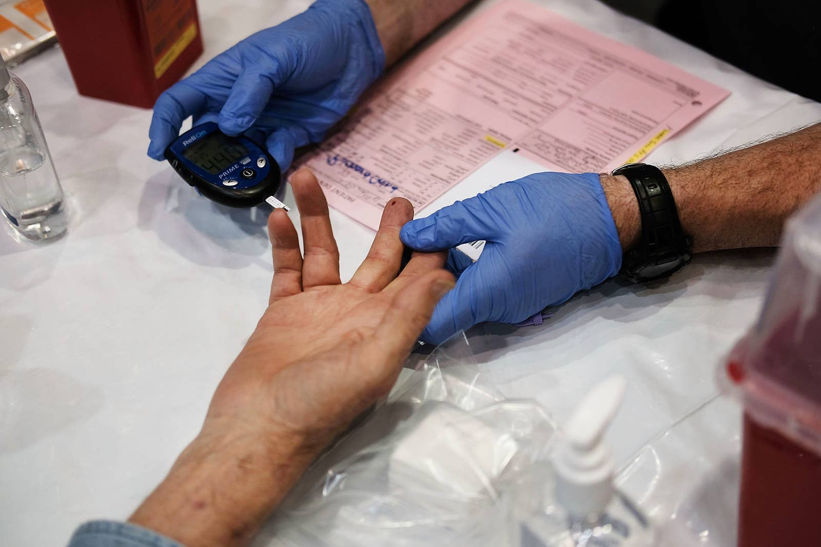 A man has his blood tested at the RAM clinic in Olean, New York, on June 10.