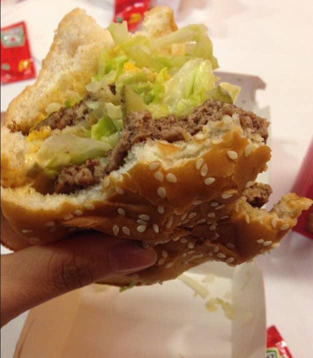Usually the top bun is thicker than the bottom one, meaning it'll absorb more burger juice and get a lot less soggy. Upside-down burgers have a lot more structural integrity.