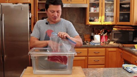 The water will push the air out of the bag leaving you with a vacuum-sealed baggie ready for freezing (or poaching). Learn how to do it here.