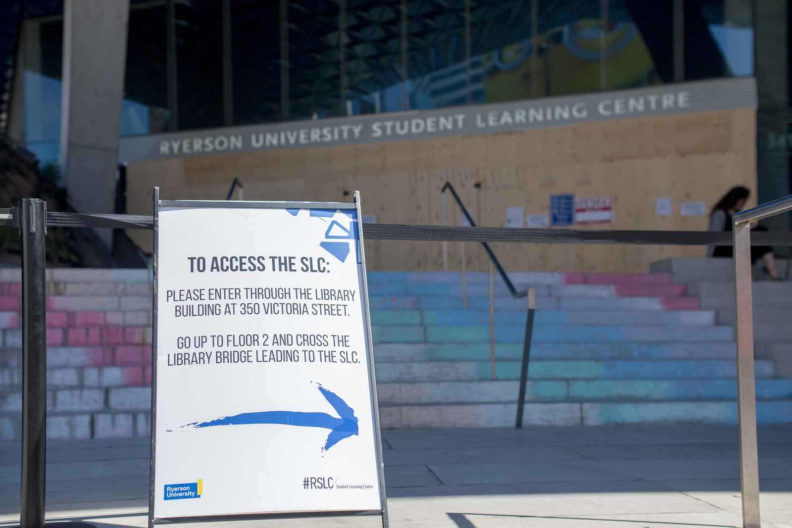 Gigantic heavy doors no more! That's right, the SLC is getting its very own set of revolving doors. The only downside to this is that until August 28th you can't access the SLC from the front so you'll need to go around through the Library building bridge.