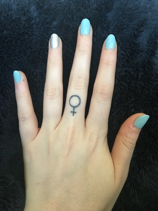 feminist symbol tattoo