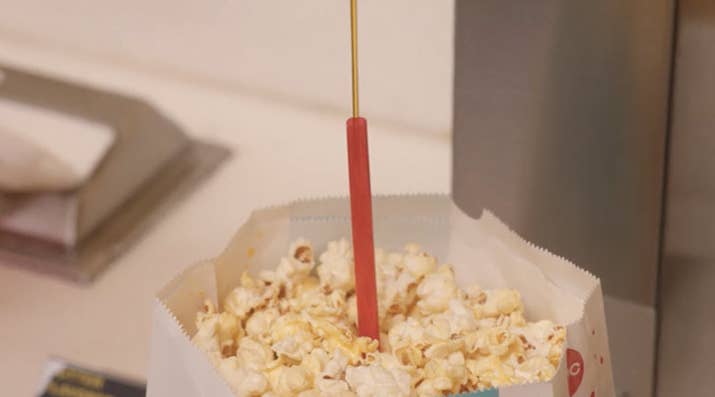 H/T Titus Andromedon and Netflix's Unbreakable Kimmy Schmidt for this trick — you move the straw around in the bottom of the bag and through your popcorn to get butter ~throughout~, instead of just on the top layer of kernels.