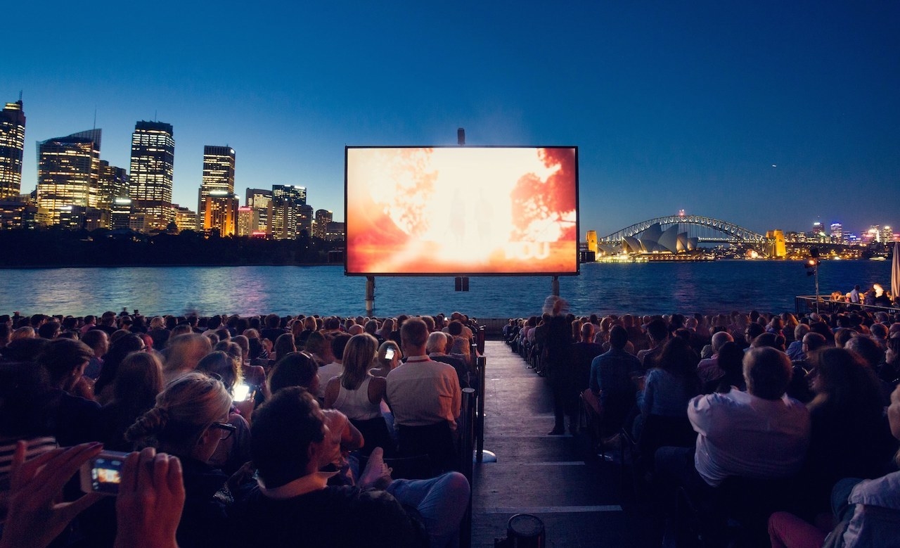 Summer nights in Sydney offer entertainment at outdoor cinemas. On a blanket, enjoying the summer breeze, you and your partner can enjoy a blockbuster movie you both love.