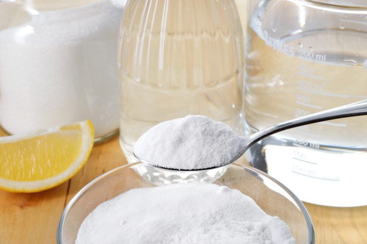 Close-up of  a bowl of salt and a glass of vinegar