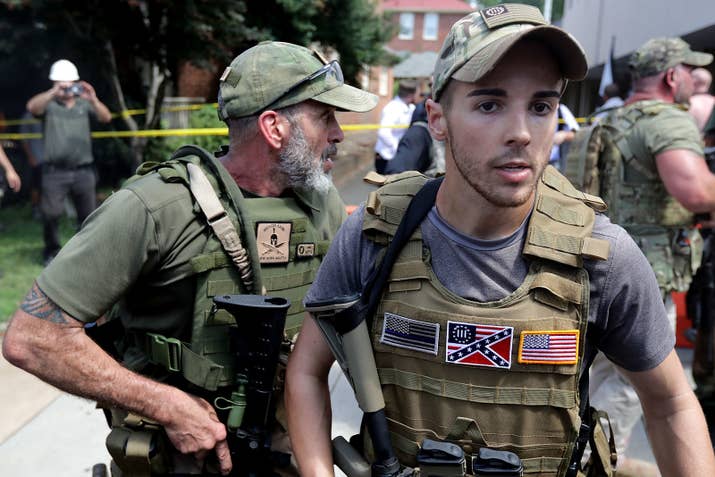 White nationalists, neo-Nazis, and members of the "alt-right" with body armor and combat weapons in Charlottesville, Virginia.