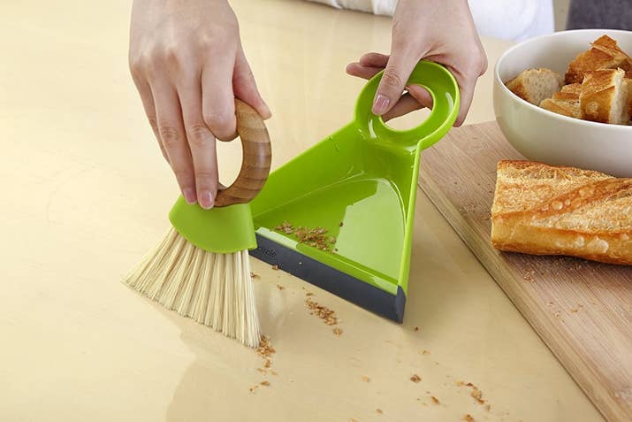 Promising review: "OK, I feel a little bit depressed to be reviewing a dustpan. I would rather be reviewing a large, canary yellow diamond solitaire ring, for example. Nonetheless, I purchased the dustpan and not the ring, so here goes. Among brush and dustpan sets, this one is a standout. The brush has fine, dense, flexible bristles that conform to every surface and sweep really well. The pan is deep, with a soft rubber lip, and its top edges curve over to contain the dust inside. Brush your crumbs into a pile, and with one stroke, sweep the pile into the pan. No need to chase around that line of crumbs that usually remains by the lip of the dustpan — you know the one I mean. When you are done cleaning up, the bamboo brush fits into the handle of the dustpan, making a tidy and attractive package. It looks like it was designed with care — not mass-produced." —E. HolmGet it from Amazon for $8.99+ (available in sizes mini and regular).