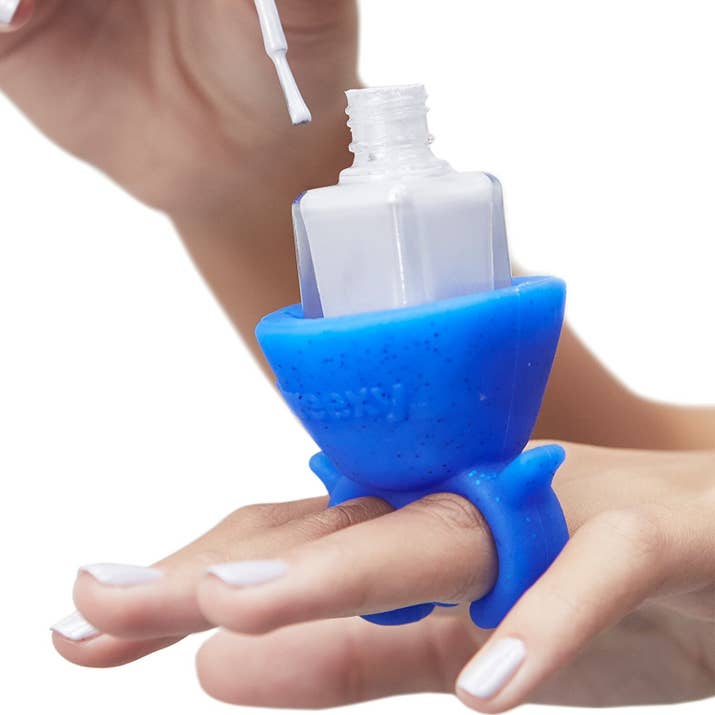 Promising review: "This product is really awesome, it can be a bit heavy but that should be expected as you are wearing a bottle of nail polish on your hand. It's really comfortable and easy to get on and off your hand, without messing up your nail polish. It's one of those gifts that's fun and practical that no one really thinks they need until they have one." —Amazon CustomerGet it from Amazon for $6.99 (available in nine colors).