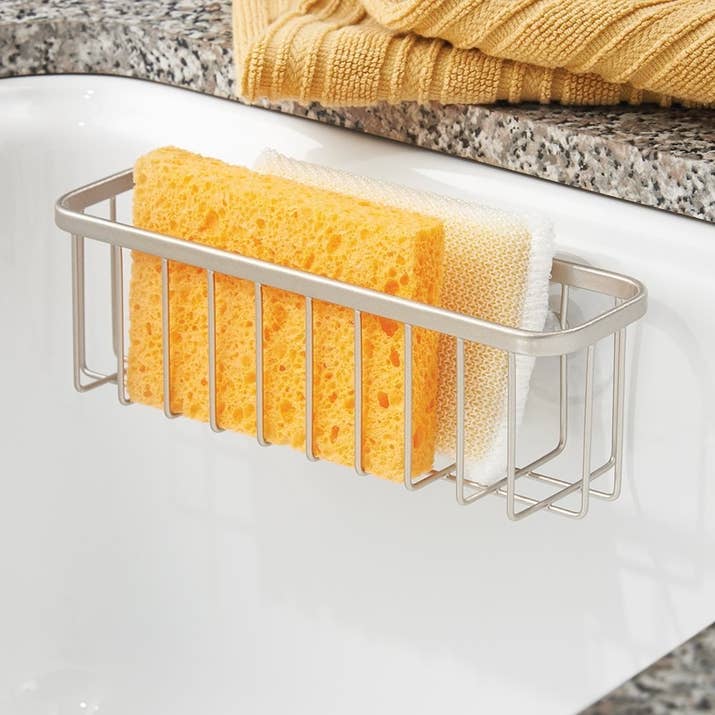 Promising review: "This is one of those cheap purchases you make that pays off big. I honestly can't imagine my life without this. I go to other people's houses and judge them when I see their sponges, just LYING THERE on the counter or the bottom of the sink. What are you, an animal? Get some self respect! Put it in its place!" —Kevin T BeyerGet it from Amazon for $7.99 (available in nine styles and two sizes).
