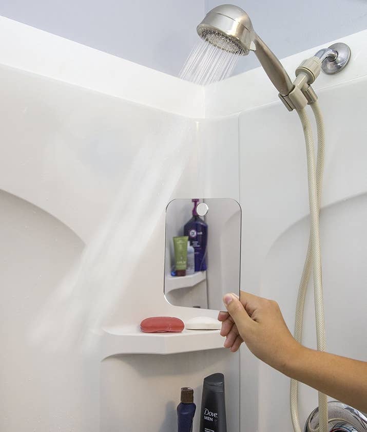 Promising review: "After 50 years I finally bought a shower mirror. To say it has transformed my life might be a stretch but it has made my shower time better. I enjoy shaving in the shower and my wife even enjoys it. I use it at home and took it on a trip recently. Works great — just hold under warm water and you're good to go — if it fogs up, just hold under water again." —MiltGet it from Amazon for $9.99.