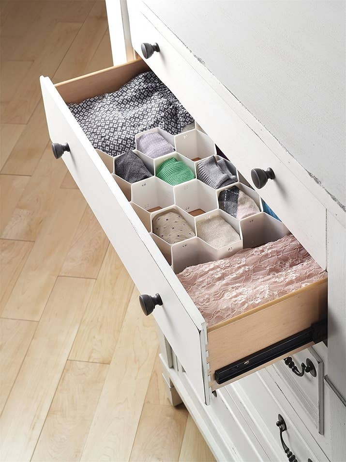 Promising review: "Okay, admittedly, I am a bit of an organization freak. I purchased two of these organizers (yes, you do need two PER drawer) to organize my underwear drawer. It's totally worth it. The gratification I got from being able to see exactly what I had, neatly organized, and easy to find...wow. I definitely recommend this product. The actual dividers are well made and super easy to assemble. As a previous reviewer said, the number of times you will look at your drawer and be totally satisfied makes the price well worth it." —BrigetteGet it from Amazon for $9.99.