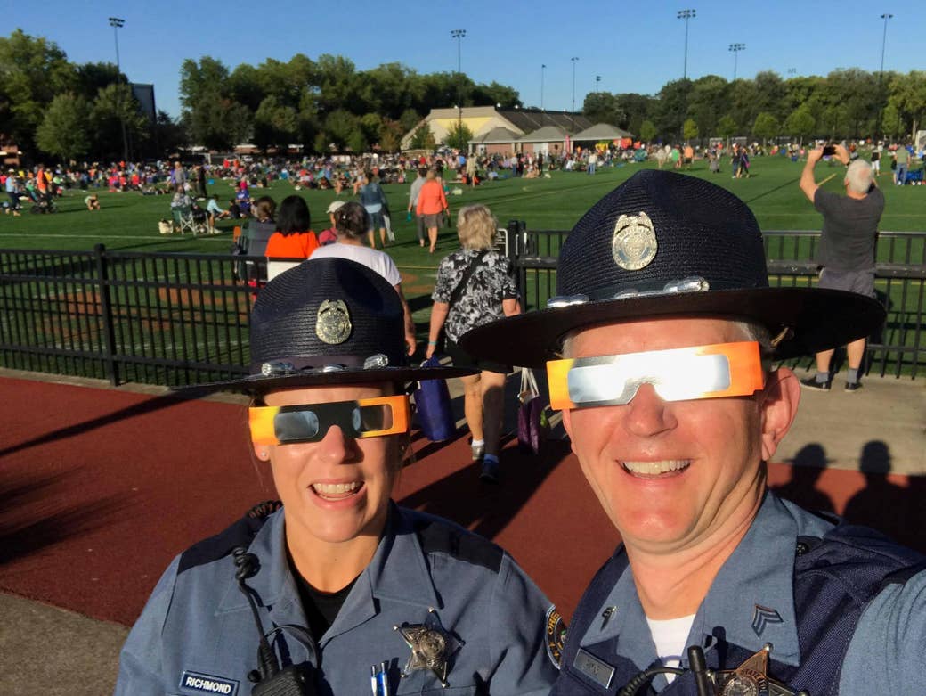Oregon State Police officers model their solar eclipse glasses while awaiting an event at Oregon State University in Corvallis.