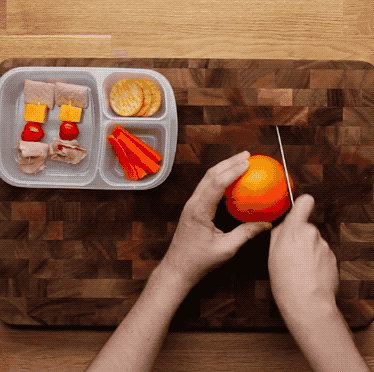 Note: Do this by cutting the top and bottom off, then making a small cut through the skin. Pull the cut apart so it opens slightly (without tearing the orange in half) and roll it back up.