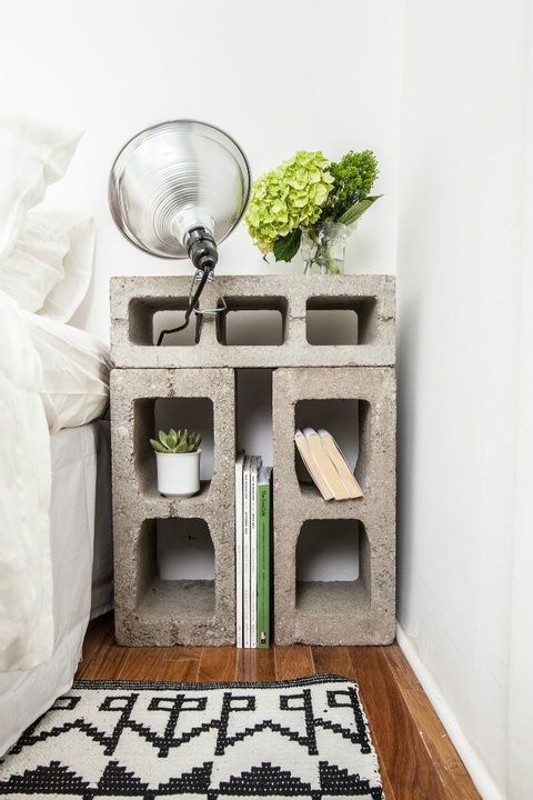 Need a place to set down your drink or DIY magazine? Cinder blocks aren't just useful for constructing houses, they can come in handy as masculine side tables too.