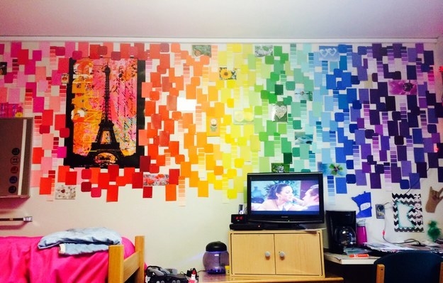 A wall covered in multicolored paint swatches