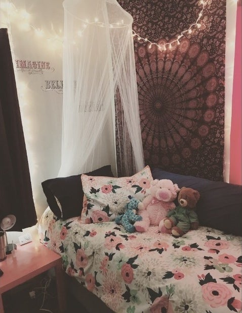 Princess bed with drapes and stuffed animals