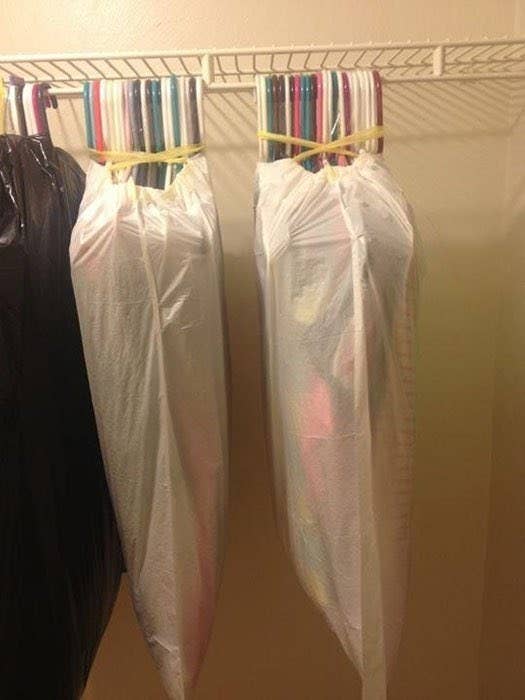 Use a Trash Bag as a Makeshift Garment Bag in Your Closet