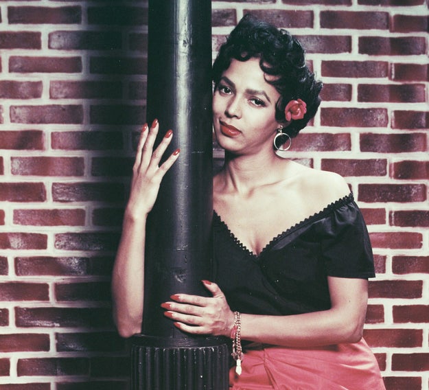 For the '50s, Sir John was inspired by Dorothy Dandridge. He credits the era's beauty trends as the beginning of the 'woke up like this.' Statement brows and red lips were the focal points, while the rest of the look was kept soft and natural.