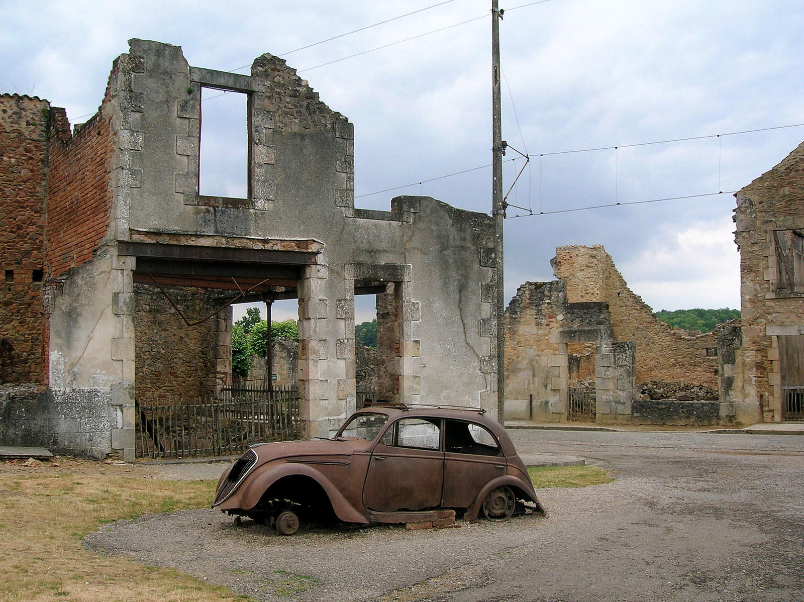 On June 10, 1944, a Nazi Waffen-SS company destroyed the village of Oradour-sur-Glane, France, massacring its inhabitants, including women and children. After the war ended, General Charles de Gaulle ordered the village not to be rebuilt, and instead left it as a memorial and museum to remind the world of the atrocities of Nazi occupation.
