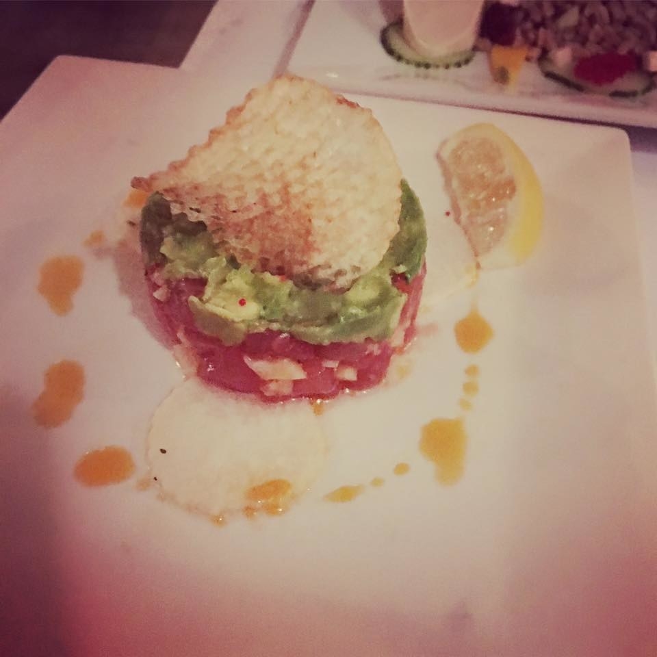 While the restaurant has three different tartare, the classic Tuna Tartare is certainly the fan favorite. The fresh, raw tuna sashimi is diced into bite-sized chunks and mixed with crispy sour apple, avocado, jicama, wasabi, cucumber, and tobiko caviar. The appetizer portion is served with a piece of chip and radish, while the entree size also includes salad and fries. Don't forget to try the other two - steak and beet tartare.