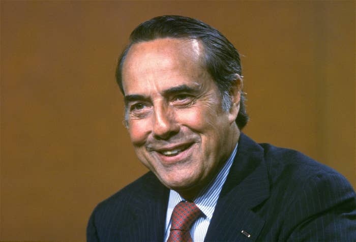 A smiling Bob Dole in a suit and tie