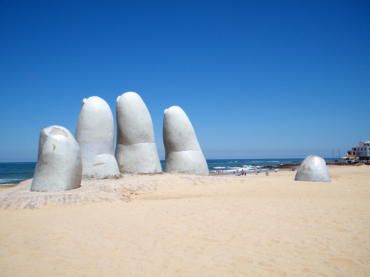 These colossal fingers jut out of the beach in a strangely amazing way. It's almost like there's a giant buried under the sand. This awesome statue was designed by Chilean artist Mario Irarrázabal in 1982.