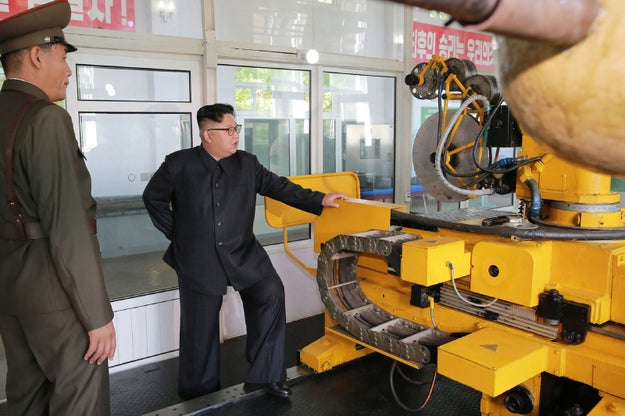 Here is my guy flaunting his wide pant leg while inspecting some kinda machine.