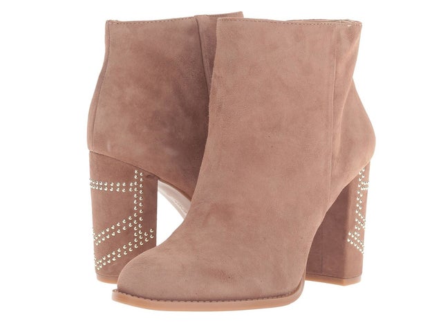 A pair of suede booties with a decorated block heel for extra coolness.