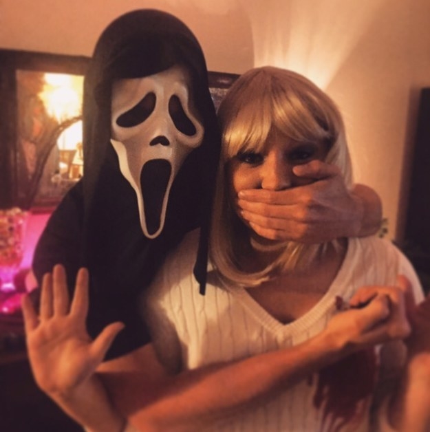 One person in a scream mask and one person in a blonde wig