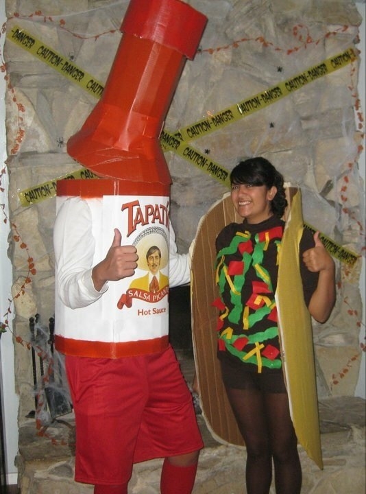 A couple dressed as a bottle of hot sauce and a taco