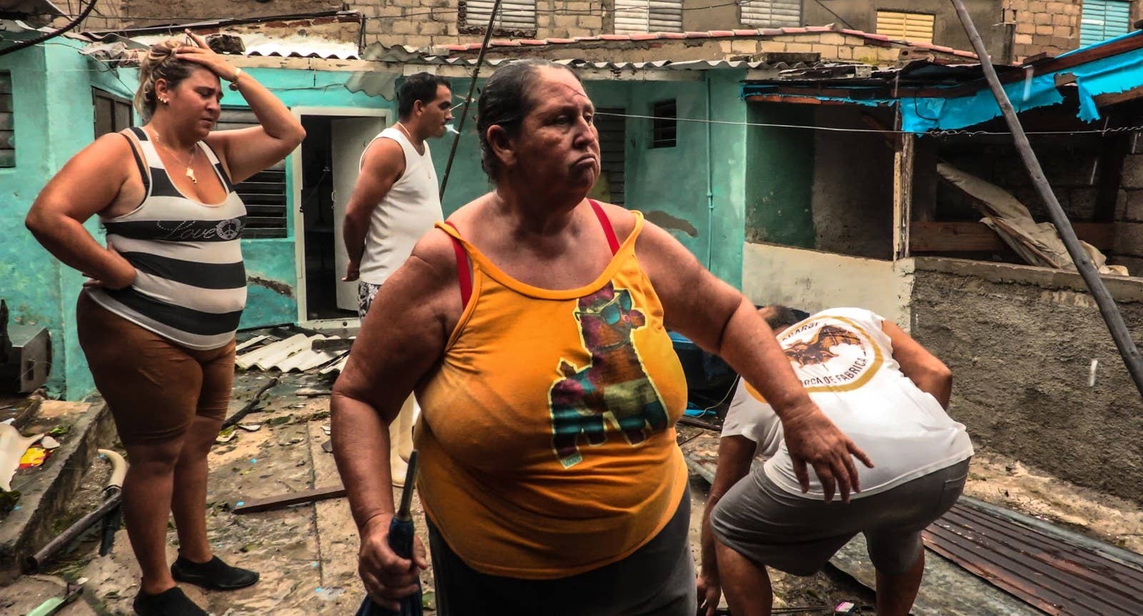 Residents return home in a town east of Havana.