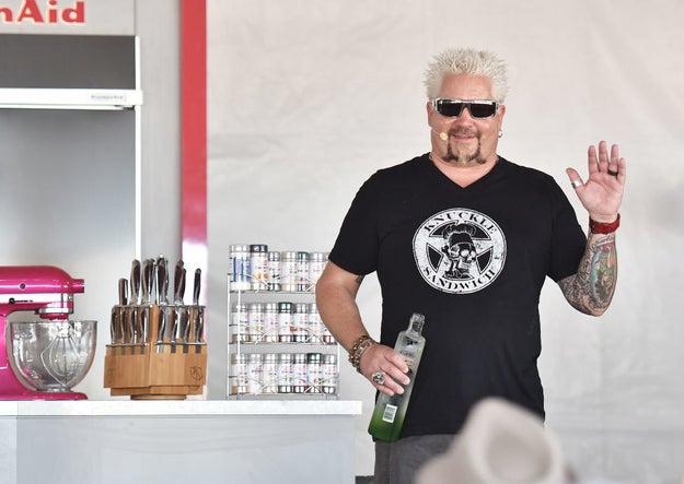 Here he is, waving at a crowd of people at the South Beach Wine and Food Festival while sporting a ~knuckle sandwich~ tee: