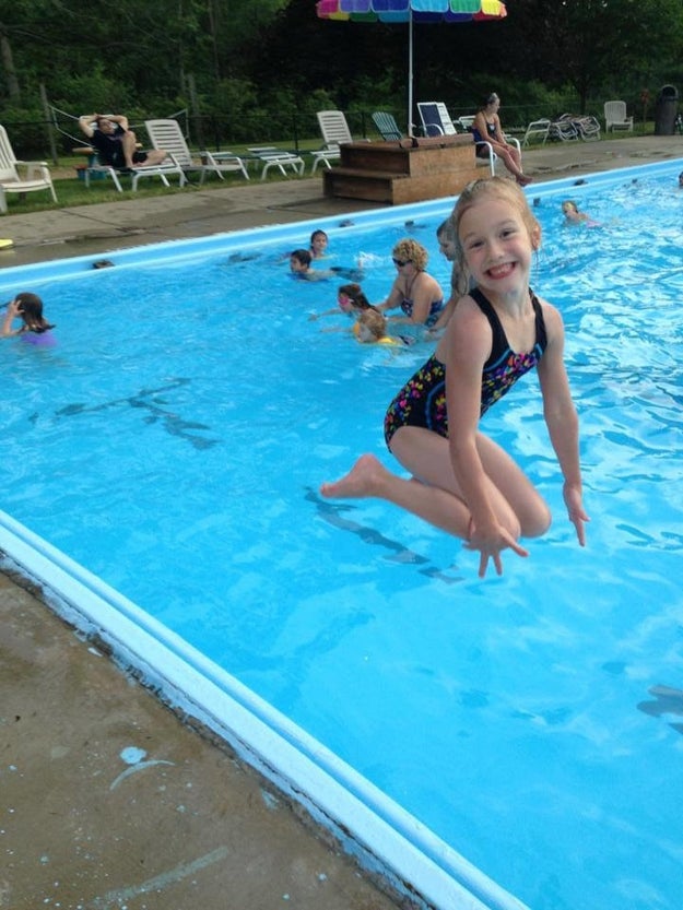 This is not a giant girl kneeling on water.