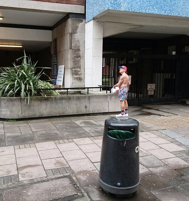 This ain't a teeny-tiny man standing on top of a trash can.