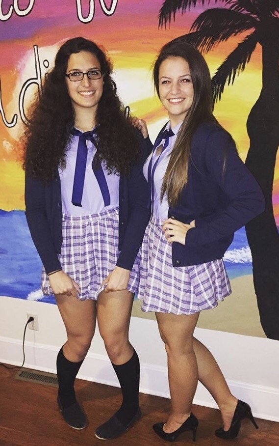 two girls wearing schoolgirl outfits