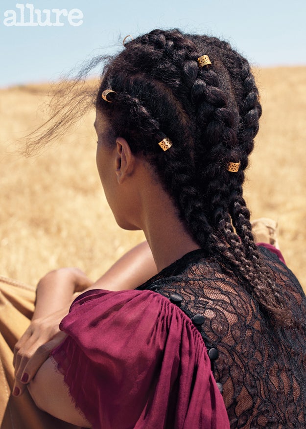 In several photos, Washington opted for unlaid edges and loose cornrows that look like a black girl's attempt to get her hair just flat enough for a new wig — and she looks absolutely perfect. On beauty pressures, specifically as they relate to black women and our hair, she said she likes to wear her natural texture because "'I want [my children] to know that their hair is perfect as it is. They don’t have to change it or straighten it.'”