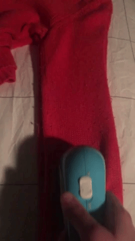 It's a simple little gadget: There's an on/off switch and three distance settings so you can control the closeness of your shave. They're (somewhat confusingly) labeled as small, medium, and large. Reviewers recommend starting out on the Large setting, which sets the blades farther from the fabric. I ended up using the medium setting on this sweater with no ill effects. All the little fuzzballs collect into a neat compartment that you can slide out and empty. It's incredibly satisfying — I think it might be my own personal version of ASMR.Honestly, my only complaint is that it requires two double-A batteries, and that's only because ugh, who has batteries?