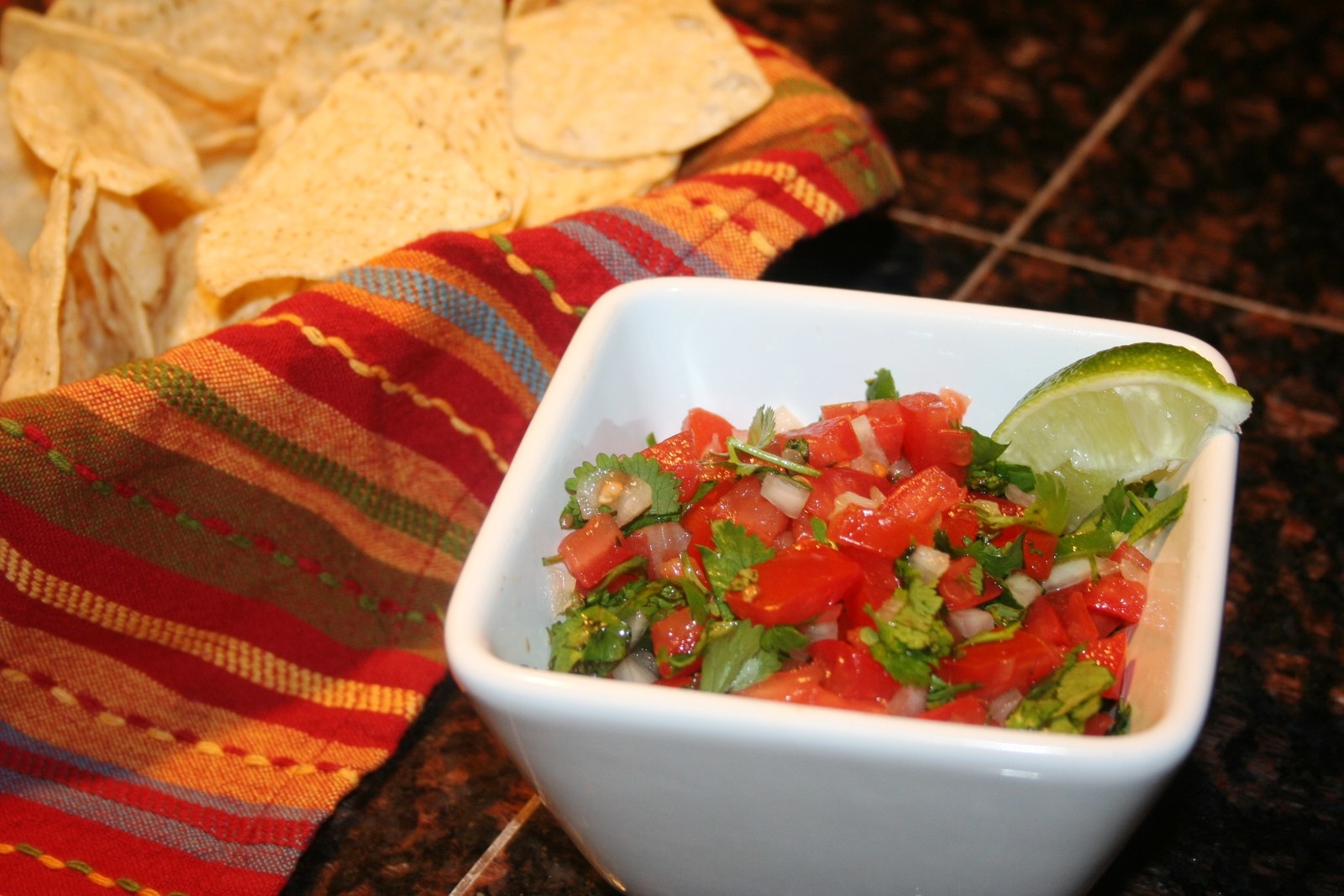 5 Second Fresh Tomato Salsa Ingredients: • ¼ small white onion, cut into 1-inch chunks• 1 small jalapeno pepper, quartered and seeded• 1 small garlic clove• 4 small plum tomatoes, quartered and seeded • ¼ cup loosely packed fresh cilantro leaves• ¼ teaspoon saltCooking Instructions: 1. Cut onion into 1-inch pieces and place into bottom of the T-fal 5 Second Chopper along with jalapeno pepper and garlic clove2. Process until medium chopped3. Add tomatoes, cilantro and salt chopping until coarsely chopped or desired texture4. Serve with tortilla chips.