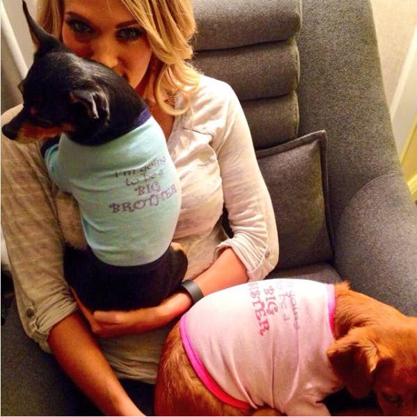 On Labor Day of 2014, the country superstar used her status as a doggie mama to announce she was going to mother a human too! Her Instagram caption: "In honor of 'Labor' Day, Ace & Penny would like to make an announcement. Their parents couldn't be happier..." Deets on the baby: Carrie and her husband, former NHL player Mike Fisher, had a boy named Isaiah, who is now 2 years old.